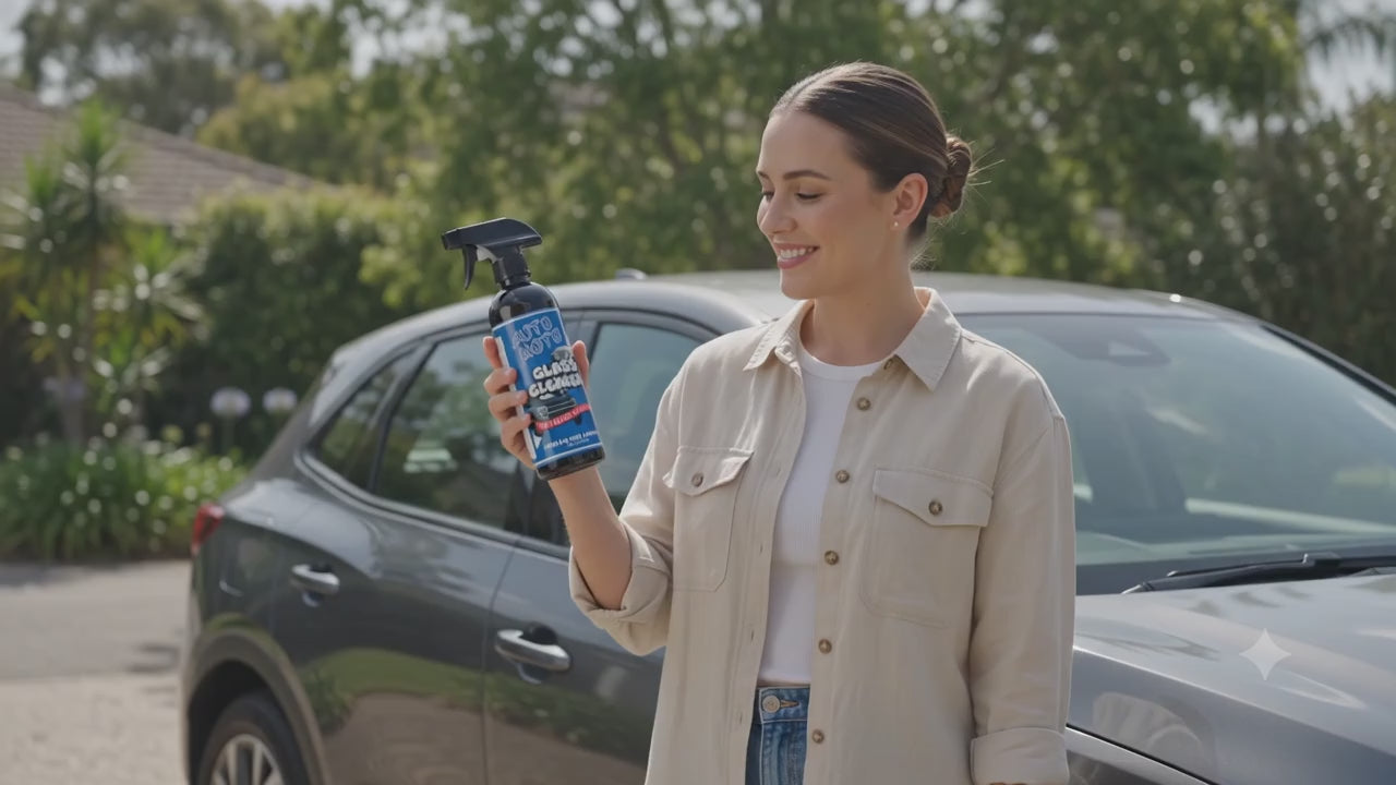 AutoMoto Glass Cleaner being used by a woman cleaning her car window